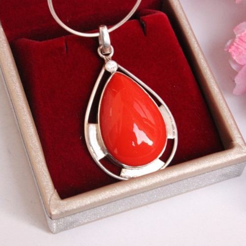 Artisan red coral stone silver pendant