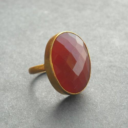 Faceted oval red carnelian gold